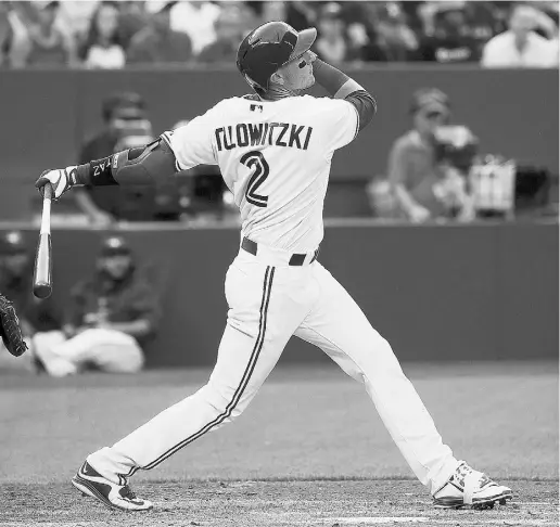  ?? Stan Behal / Postmedia Netwo rk ?? Blue Jays shortstop Troy Tulowitzki hit a third-inning home run and a pair of doubles in his first game on Wednesday.