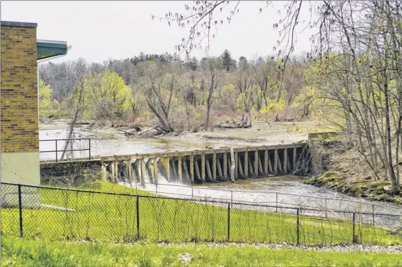  ?? Photos by Paul Buckowski / Times Union ?? The timber Ida Lake Dam was declared structural­ly unsound back in 2018. Troy’s mayor believes removing it will improve recreation­al options.