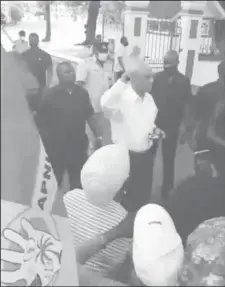  ??  ?? A screen shot taken from a live video which shows caretaker President David Granger addressing supporters outside of State House yesterday afternoon.