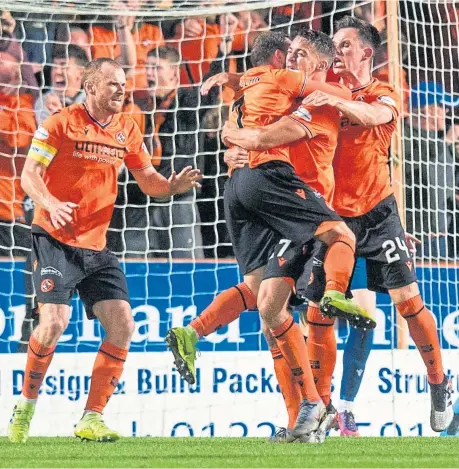  ?? Picture: SNS. ?? Louis Appere celebrates with Paul McMullan and Lawrence Shankland after scoring in Dundee United’s 6-2 victory over Dundee in last night’s Ladbrokes Championsh­ip game at Tannadice.