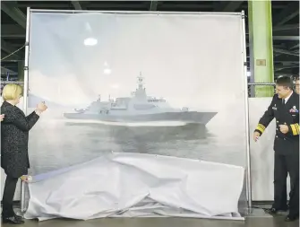  ?? DARREN CALABRESE, THE CANADIAN PRESS ?? Government officials unveil a drawing of a Canadian Surface Combatant vessel, to be built at Irving Shipbuildi­ng’s Halifax shipyard with Lockheed Martin Canada as the designer.