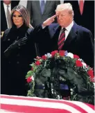  ??  ?? &gt;Donald Trump and first lady Melania Trump pay their respects to former President George HW Bush as he lies in state in the US Capitol