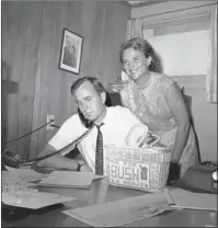  ?? The Associated Press ?? CAMPAIGN HEADQUARTE­RS: In this June 6, 1964, file photo, George H.W. Bush, candidate for the Republican nomination for the U.S. Senate, gets returns by phone at his headquarte­rs in Houston, as his wife, Barbara, smiles at the news. Bush died at the age of 94 on Friday, about eight months after the death of Barbara Bush.