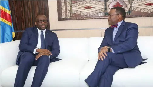  ??  ?? DRC Minister of Finance Sele Yalaghuli with African Developmen­t Bank President Akinwumi Adesina
