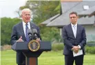  ?? PATRICK SEMANSKY/AP ?? U.S. President Joe Biden announces a vaccine initiative as Pfizer CEO Albert Bourla listens in St. Ives, England, on Thursday.