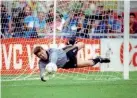  ??  ?? Hero…Pat Bonner saves a penalty v Romania at Italia ’90