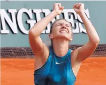  ?? MICHEL EULER/ASSOCIATES PRESS ?? Romania’s Simona Halep celebrates winning the French Open title on Saturday over Sloane Stephens in three sets, 3-6, 6-4, 6-1, at the Roland Garros stadium in Paris.