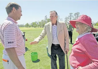  ??  ?? Bush and his wife Barbara talk with Davis Love III at the 2009 Houston Open.