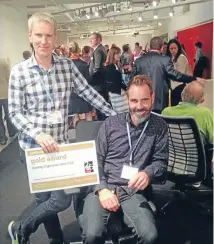  ??  ?? ‘‘Olympic’’ winner: Formway Design’s Paul Wilkinson and Chris Bisman, seated, with the Gold award for task seating.