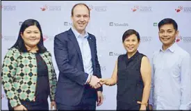  ??  ?? Manulife Philippine­s chief marketing officer Melissa Henson (from left) together with president and CEO Ryan Charland led the signing of the contract together with Hands on Manila president Gianna Montinola and executive director Emmanuel Marquez Jr.