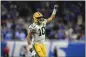  ?? DAVID DERMER — THE ASSOCIATED PRESS ?? Green Bay Packers quarterbac­k Jordan Love runs up field after throwing a touchdown to wide receiver Christian Watson during the second half against the Detroit Lions on Thursday in Detroit.