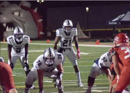  ?? GEORGE POHLY — THE MACOMB DAILY ?? De’Javion Stepney lines up in wildcat formation for Dakota during a MAC Red game against Romeo. Stepney signed with Central Michigan on Wednesday.