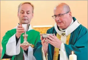  ??  ?? Archbishop Philip Tartaglia took part in the service to ordain Father Vincent Toal.