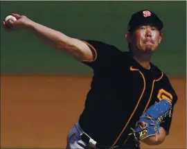  ?? ASHLEY LANDIS — THE ASSOCIATED PRESS ?? The Giants want reliever Shun Yamaguchi to throw his four-seam fastball less often this year.