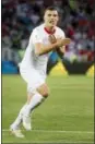  ?? LAURENT GILLIERON — KEYSTONE VIA AP ?? Switzerlan­d’s Granit Xhaka celebrates after scoring against Serbia in the Kaliningra­d Stadium in Kaliningra­d, Russia, Friday.