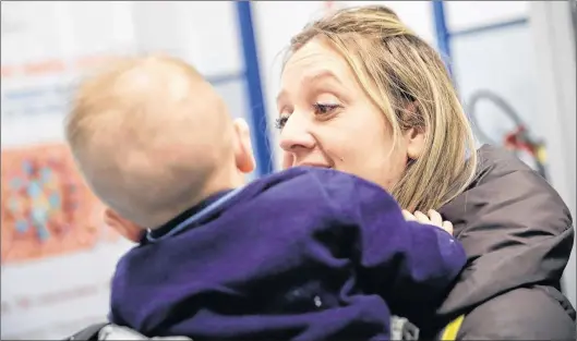  ?? AP FILE ?? Luana Monoclesi, holds her eight-month-old baby in a vaccine centre in Rome.