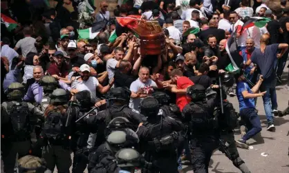  ?? Photograph: Ammar Awad/ Reuters ?? Israeli police clashed with Palestinia­ns carrying the casket of Shireen Abu Aqleh to her funeral on Friday.