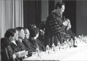  ?? JONJON VICENCIO ?? Chief Justice Renato Corona speaks before law graduates during their oath-taking ceremonies at the Philippine Internatio­nal Convention Center yesterday. With him are associate justices.