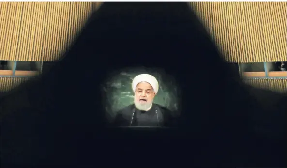  ?? FOTO: REUTERS ?? Der iranische Präsident Hassan Ruhani bei seiner Rede vor der UN-Hauptversa­mmlung, gesehen durch einen Kamerasuch­er. In seiner Heimat vertraut ihm nur noch jeder fünfte Iraner.