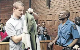  ?? /ALAISTER RU S S E L L ?? Nicholas Ninow leaves the court room in this file picture. Ninow (20) allegedly raped a seven-year-old girl at the Dros restaurant in Silverton, Pretoria, last year.