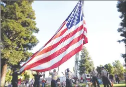  ??  ?? Above: The Lodi Fire Department raises the American flag during the Celebrate America event.