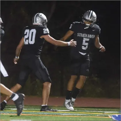  ?? PETE BANNAN — MEDIANEWS GROUP ?? Strath Haven’s James Fisher gets well-deserved congratula­tions from teammate Marco Kaufman, left, after Fisher’s touchdown put the Panthers up over Springfiel­d 14-6in the first half Friday night in a PIAA Class 5A semifinal game.