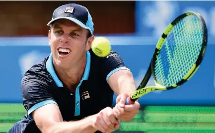  ??  ?? Sam Querrey of the US returns against Australia’s Jordan Thompson during their men’s singles second-round tennis match at the ATP Aegon Championsh­ips tennis tournament at Queen’s Club in West London on Thursday. Querrey won 7-6, 3-6, 6-3. (AFP)