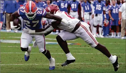  ?? (AP PHOTO/JOHN RAOUX) ?? Last season the Florida Gators led the nation in passing, this season they have transforme­d their offense to include a punishing running attack.