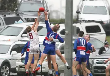  ?? ?? Dusties players Will Gibson and Kane Taylor and Bunyip’s Aaron Paxton compete for the ball.