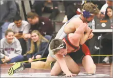  ?? Emily J. Reynolds / For Hearst Connecticu­t Media ?? Bristol Eastern’s Justin Marshall takes on New Canaan’s Nate Sibbett during the Class L wrestling championsh­ips on Saturday.