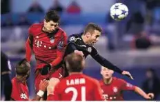  ?? AFP ?? Heads up Bayern Munich’s Robert Lewandowsk­i (left) heads past Dinamo Zagreb’s Ivo Pinto during their match in Zagreb.