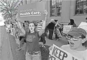  ?? THOMAS J. TURNEY/STATE JOURNAL-REGISTER ?? Abortion is severely restricted in much of the South and nearby states, including bans throughout pregnancy in Alabama, Arkansas, Kentucky, Louisiana, Mississipp­i, Oklahoma, Tennessee, Texas and West Virginia. In Georgia, it’s allowed only in the first six weeks.