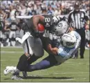 ?? The Associated Press ?? Oakland Raiders running back Marshawn Lynch (24) is brought down at the two-yard line by Tennessee Titans inside linebacker Wesley Woodyard during Sunday’s game.