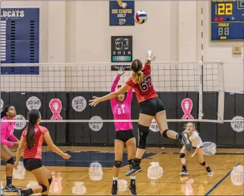  ?? Cory Rubin/The Signal (See additional photos on signalscv.com) ?? Shelby Grubbs goes for a kill that would win the Foothill League championsh­ip for the Hart Indians in a match against West Ranch at West Ranch High School on Tuesday night.