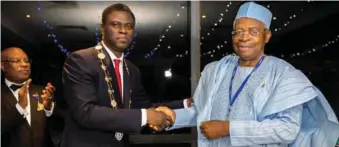  ??  ?? President, Nigerian Institute of Quantity Surveyors (NIQS), QS Obafemi Onashile in a warm handshake with the Chairman of TY Danjuma Holdings, Lt. Gen Theophilus Yakubu Danjuma after the latter received Honorary Fellow Award of NIQS, during the First...