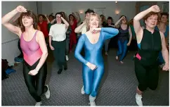  ??  ?? Rosemary taking charge of a class, 1990, and below, with husband Mike in 2012 behind the scenes of Dancing on Ice