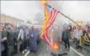  ?? AFP ?? Iranians burn flags of the United States.