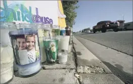  ?? Brian van der Brug Los Angeles Times ?? A MEMORIAL for Anthony Avalos on a sidewalk near the family’s home in Lancaster in 2018. If convicted, the boy’s mother and her boyfriend face life in prison.