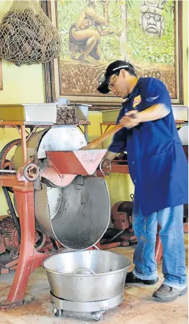 ??  ?? AGE OLD: Chocolate making in Mexico as it is done here at Mayordomo chocolate shop in Oaxaca