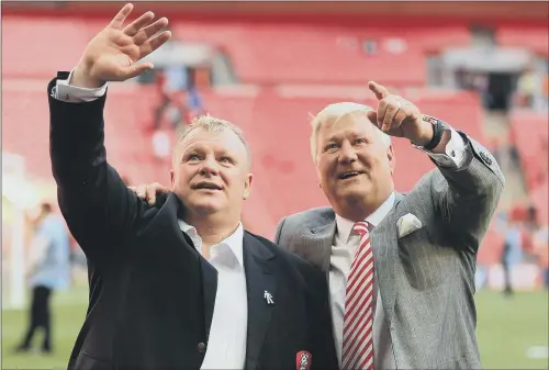  ?? PICTURE: PA ?? REUNITED: Former Rotherham United manager Steve Evans, left, celebrates with chairman Tony Stewart after the League One play-off final at Wembley in 2014.