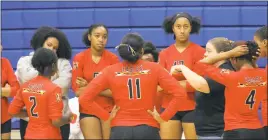  ?? STAFF PHOTO BY JOHN NISWANDER ?? North Point head coach Sara Young addresses her team during a first set timeout in Thursday’s straight sets win on the road at Thomas Stone. The Eagles won with scores of 25-13, 25-8 and 25-4.
