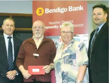  ??  ?? Neerim District Community Bank branch manager Brendan O’Brien (left) and Neerim District Financial Services chairman Tim Kubale (right) present sponsorshi­p to the Neerim District Seniors Club president Robert Gration and treasurer Catie Langelaan.