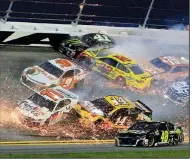  ?? AP/RON SANDER ?? Several cars are involved in a crash on lap 54 of Saturday night’s NASCAR Monster Energy Cup Series race at Daytona Internatio­nal Speedway. The race was slowed by 11 cautions and only 13 of 40 starters were running at the finish.