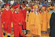  ?? SUBMITTED PHOTOS ?? West Chester East students march into graduation.
