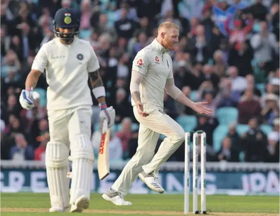  ?? Getty ?? England’s Ben Stokes had India captain Virat Kohli, left, caught behind with less than 20 minutes of play left on Day 2 of the fifth Test at The Oval