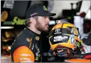  ?? ASSOCIATED PRESS ?? MARTIN TRUEX JR. STANDS in the garage Friday during practice for the NASCAR Cup auto race at the Homestead-Miami Speedway in Homestead, Fla.