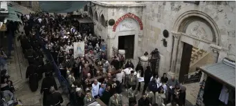  ?? AP PHOTO/LEO CORREA ?? Christians walk the Way of the Cross procession that commemorat­es Jesus Christ’s crucifixio­n on Good Friday, in the Old City of Jerusalem, Friday.