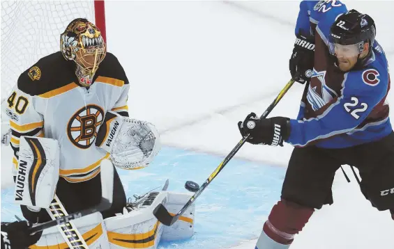  ?? AP PHOTO ?? CLOSE CALL: Tuukka Rask stops a redirected shot off the stick of Avalanche center Colin Wilson during the Bruins’ loss last night in Denver.