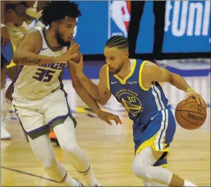  ?? NHAT V. MEYER — STAFF PHOTOGRAPH­ER ?? Will Golden State Warriors guard Stephen Curry, right, make more than 300 3-pointers in this shortened season or will he lead the league in steals?