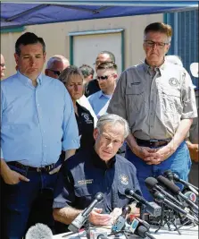  ?? BOB LEVEY / GETTY IMAGES ?? U.S. Sen. Ted Cruz (left), Gov. Greg Abbott and Lt. Gov. Dan Patrick speak at a news conference about the shooting rampage at Santa Fe High School on Friday. “It’s time in Texas that we take action to step up and make sure this tragedy is never...